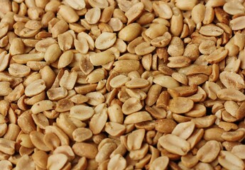 Delicious roasted peanuts with salt close up view