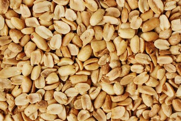 Delicious roasted peanuts with salt close up view