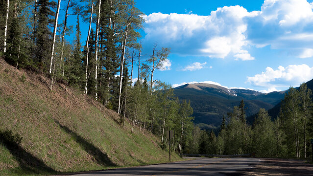 Road through Carson National Forest in the Sangre de Cristo Range of the Rocky Mountains, with Wheeler Peak in the distance