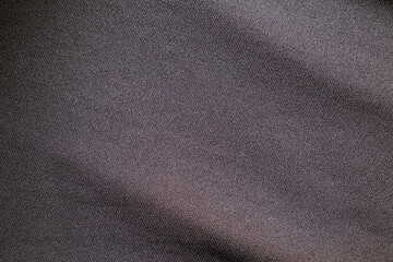 Top view close up shot of Black grey fabric cotton shirt with woven gradient detail. Background and wallpaper concept.