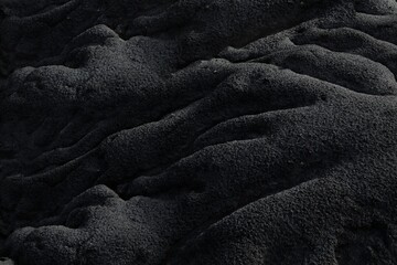 Grayscale shot of the sand under the lights - cool for wallpapers and backgrounds