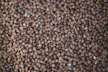 Buckwheat. Dry buckwheat background. The texture of buckwheat