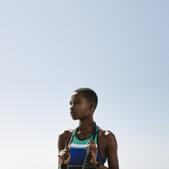 Woman standing outside holding a skipping rope