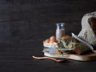 Black Sesame Marble Cake on Dark Background with Copy Space. 