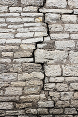 a crack in the old masonry, in the wall.