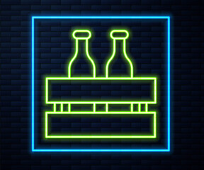 Glowing neon line Pack of beer bottles icon isolated on brick wall background. Wooden box and beer bottles. Case crate beer box sign. Vector Illustration.