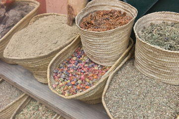 Baskets with spies, herbs and dried flowers on a market