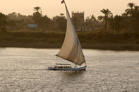 Sailing on the Nile with traditional river sailing ships photographed in daylight