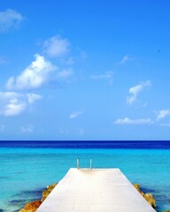 Fototapeta premium tropical beach with wooden pier