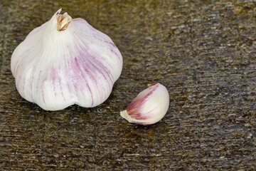 a head of garlic placed on a nori leaf