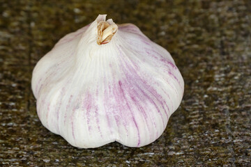 a head of garlic placed on a nori leaf