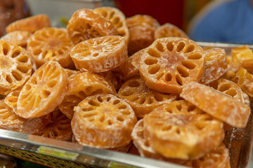 Orange candy for sale in market
