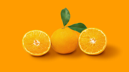 Orange fruit and ripe half of orange fruit on orange background
