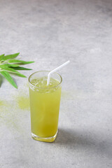 Iced green tea placed on a cement table