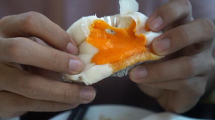 Salted egg lava cream dim sum boa bun pouring before eating