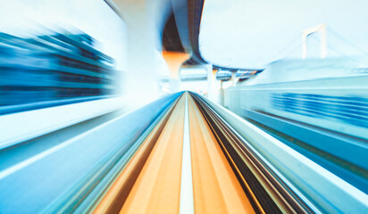 Abstract high speed technology POV train motion blurred concept from the Yuikamome monorail in Tokyo, Japan - obrazy, fototapety, plakaty