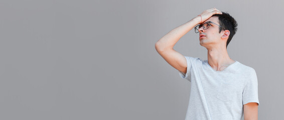 Portrait of annoyed man roll eyes irritated, facepalm, cant stand hearing it anymore, complaining...