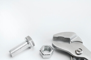 Wrench. Bolt and nut. On a white background. Isolated. Repair services. Plumbing