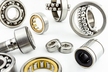 Background made of several ball bearings, isolated on a white background, selective focus.