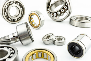 Background made of several ball bearings, isolated on a white background, selective focus.