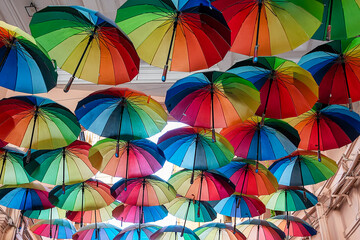 Multi coloured umberallas make a shady canopy over the side streets of Bucharest