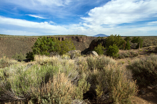 Surface view of the Rio Grande Gorge in Rio Grande del North National Monument, with extinct volcano Ute Mountain in distance