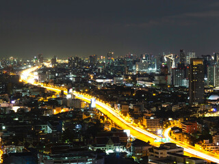 Fototapeta na wymiar Bangkok cityscape night view in the business district, skyscraper modern building, hotel and resident area with night light in capital city