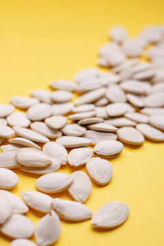 Pumpkin Seeds Background, Vertical Image. Blurred Photo