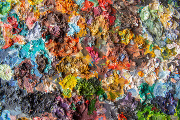 Rainbow of oil paint colors on palette, colorful art background