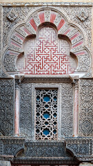 details of a decorated window of the outer wall of mezquita. cordoba. spain. example of arab...