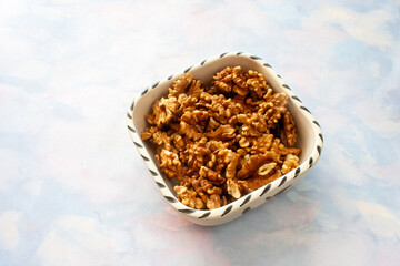 Walnut on wooden table. Diet food, vegetarian and delicious