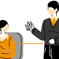 male and female workers wearing face masks in the office with distance allowed