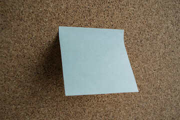 Fototapeta premium White sticky note paper on a cork board. Copy space