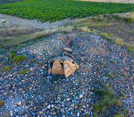 View from a drone of the Dolmen in the Alto de la huesera in Laguardia in the Rioja Alavesa with the Sierra de Cantabria in the background. Alava, Basque Country, Spain, Europe