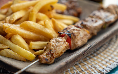 Skewer of monkfish and french fries