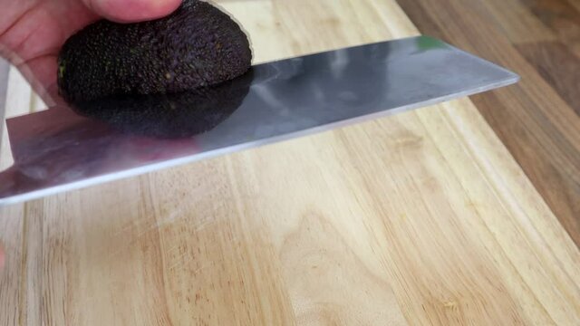 Cutting An Avocado In Half And Taking The Pip Out 