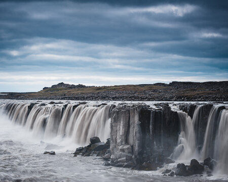 Powerful waterfall in Iceland on a cloudy day