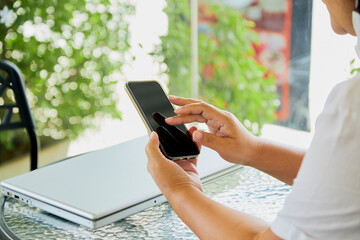 woman using mobile smart phone and notebook