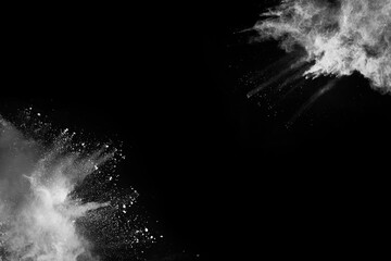 White powder explosion on black background. Colored cloud. Colorful dust explode. Paint Holi.