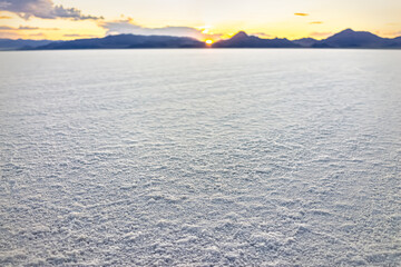 Bonneville Salt Flats low angle view of texture at foreground near Salt Lake City, Utah and mountain view during sunset with nobody open landscape