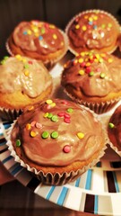 homemade cupcakes and muffins with chocolate toppings and decorations