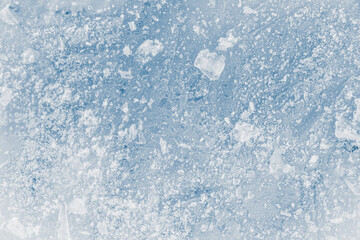 Ice texture blue toned background. Texture crunchy frosted surface of ice block.