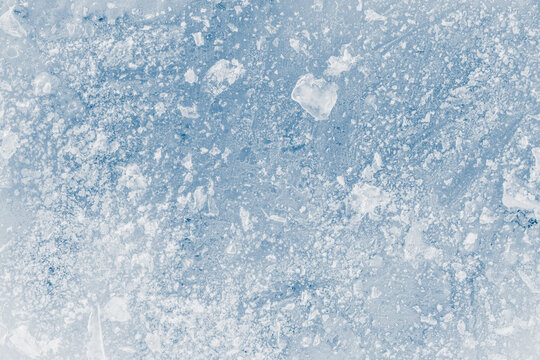 Ice texture blue toned background. Texture crunchy frosted surface of ice block.