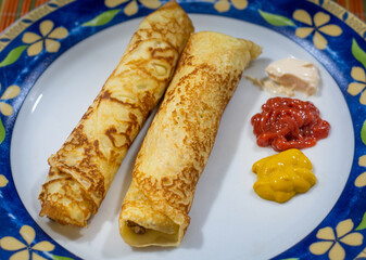 Brazilian pancake rolls stuffed with meat