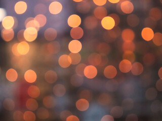 The bokeh effect. Unfocused blurry photo. Abstract background of city illumination. Bright round glowing balls. One of a series of photos.