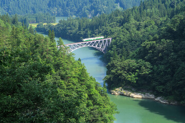 Obraz na płótnie Canvas Tadami railway line and Tadami river in summer season, Fukushima, Japan