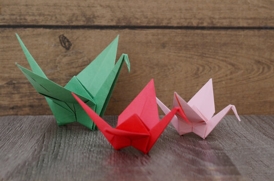 Origami birds: Colorful paper cranes folding