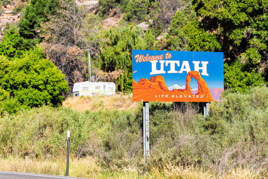 La Sal, USA - August 14, 2019: Sign closeup for welcome to Utah near Arches National Park and moab with famous arch image on road highway from Colorado 46 90