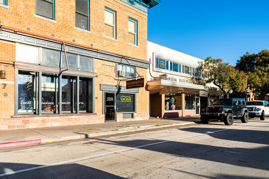 Moab, USA - August 14, 2019: Utah city main street in small town near Arches National Park in summer with morning empty road by stores shops