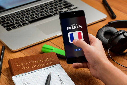Man is learning French using a smart phone app